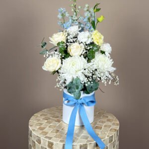 Baby boy flower arrangement with soft blue and white seasonal flowers Gold Coast florist