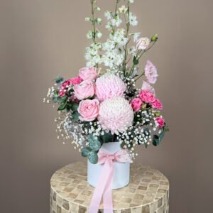 Baby girl flower arrangement with soft pink and white seasonal flowers Gold Coast florist